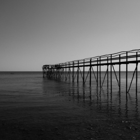 Black and white image of a boardwalk in Matlock, Manitoba