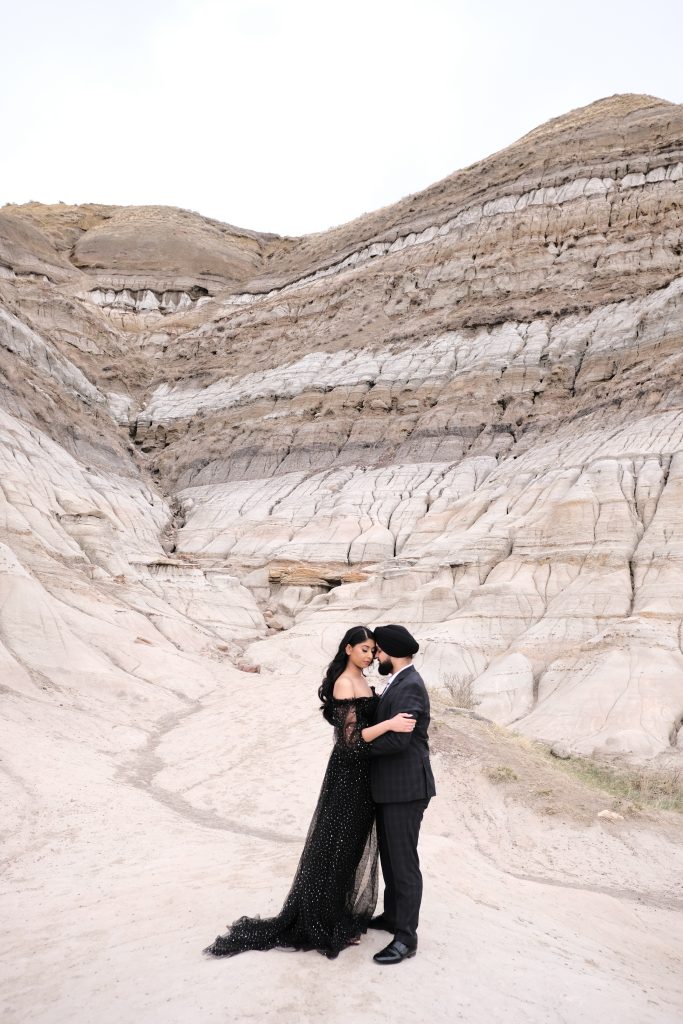 Engagement photoshoot of a couple in all black at Hoodoo's Trail