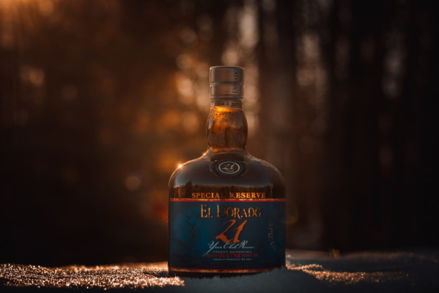 Commercial picture of a bottle of El Dorado 21 year old rum, photographed in the snow at Birds Hill Park, Manitoba