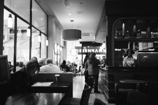 Black and white 35mm film photography image of a busy cafe in Dublin, Ireland