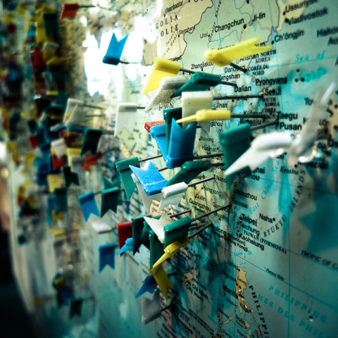 Close up shot of a map with pins in various locations, photographed at the Forks, Winnipeg with a Fujifilm X30